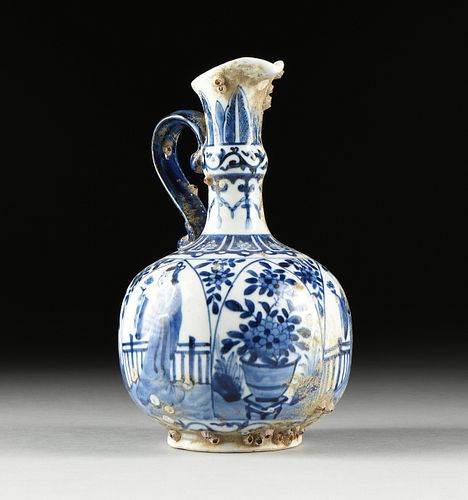A CHINESE BLUE AND WHITE PORCELAIN EWER, SHIPWRECK ARTIFACT, ARTEMIS LEAF MARK, KANGXI PERIOD (1662-1722),