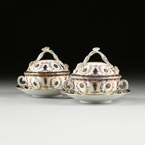 A PAIR OF DRESDEN GILT AND PAINTED PORCELAIN TWO HANDLE LIDDED TUREENS ON SAUCERS, CARL THIEME FACTORY, POTSCHAPPEL, EARLY 20TH CENTURY,