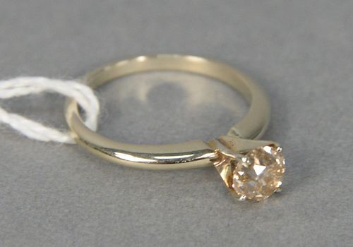 14 karat yellow gold and diamond engagement ring set with center diamond approximately .60 carats, size 5.25.