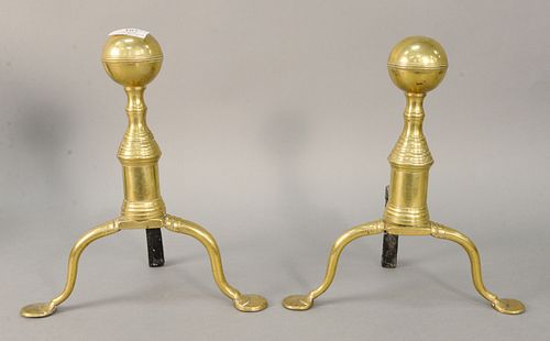 Pair of brass penny foot andirons each with ball finial and short fire dogs, ht. 12". Estate of Marilyn Ware Strasburg, PA.