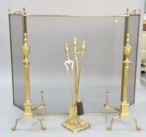 Four piece fireplace grouping to include a pair of brass andirons ht. 31", fireplace tools, along with a three part screen.
