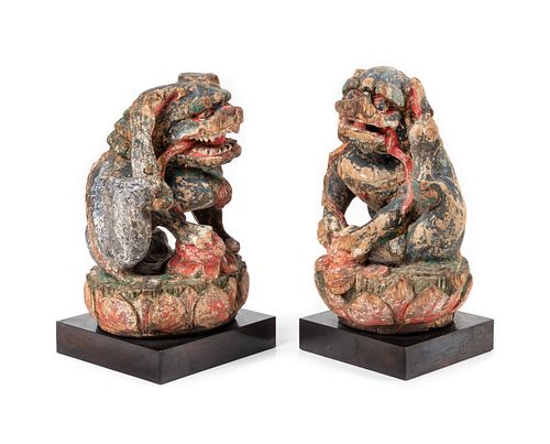 A Pair of Polychrome Painted Wood Figures of Fu Lions