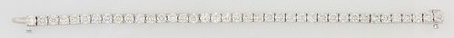 18K White Gold Diamond Tennis Bracelet, each of the 39 links with a graduated round diamond, total diamond weight- 11