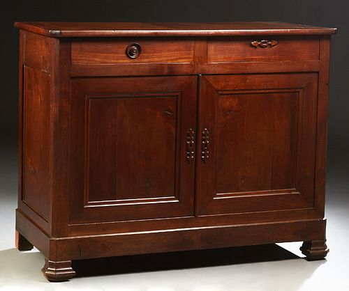 French Provincial Carved Cherry Louis Philippe Sideboard, 19th c., the canted corner top over two frieze drawers and double cupboard...