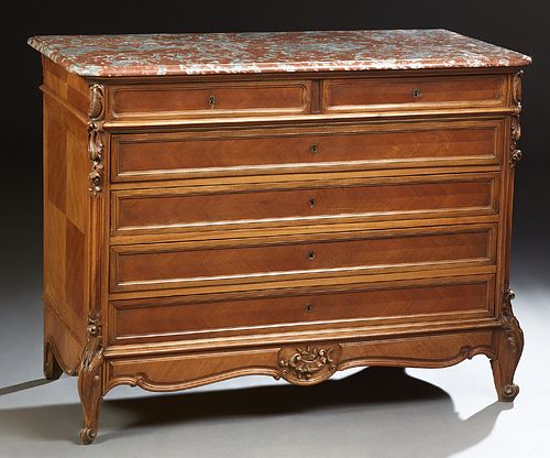 French Louis XV Style Carved Walnut Marble Top Commode, late 19th c., the stepped rounded corner and edge highly figured rouge marbl...