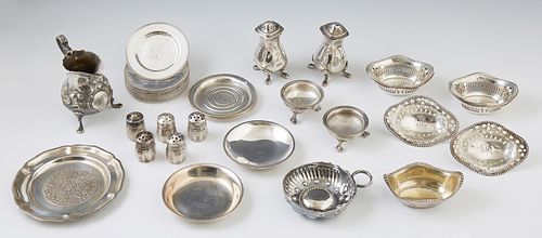 Thirty-Eight Sterling Pieces, consisting of 15 butter pats; an English salt and pepper shaker; 8 reticulated nut dishes; an oval bea...