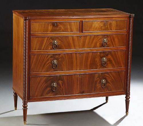 English Style Carved Mahogany Chest, early 20th c., the reeded edge cookie corner top over two frieze drawers above three long drawe...