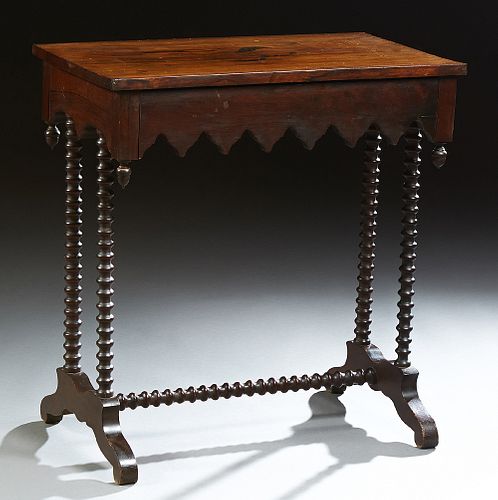 American Carved Rosewood Gothic Revival Side Table, 19th c., the rectangular top over a drawer with a Gothic serpentine skirt, on bo...