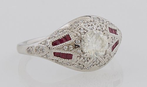 Lady's Platinum Dinner Ring, with a central .62 carat round diamond, atop a border of round diamonds, flanked by tapering sides moun...