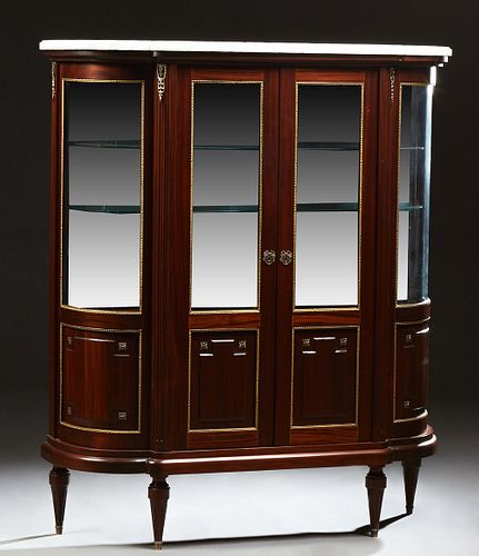 French Louis XVI Style Carved Mahogany Marble Top Ormolu Mounted Vitrine, 20th c., the ogee edge figured white marble over double do...