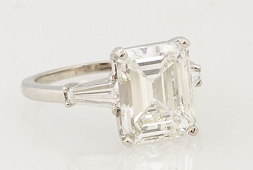 Platinum Engagement Ring, with a 3.83 ct. emerald cut diamond, flanked by two tapered diamond baguettes, Color- I, Clarity- VS-1, wi...