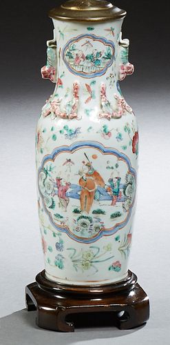 Chinese Porcelain Baluster Vase, 19th c., the everted neck with Foo dog mounted handles and small reserves of children over relief d...