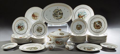 Fifty-Seven Piece Set of French Porcelain Dinnerware, 20th c., with gilt scrolled rims and hunting decoration, consisting of 23 dinn...