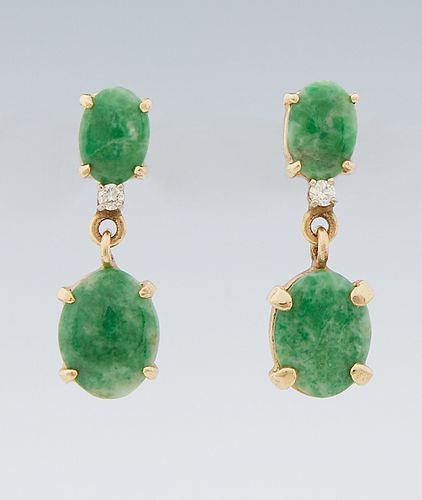 Pair of 14K Yellow Gold Pendant Earrings, with an oval cabochon jade mounted stud with a small round diamond, suspending a larger ca...