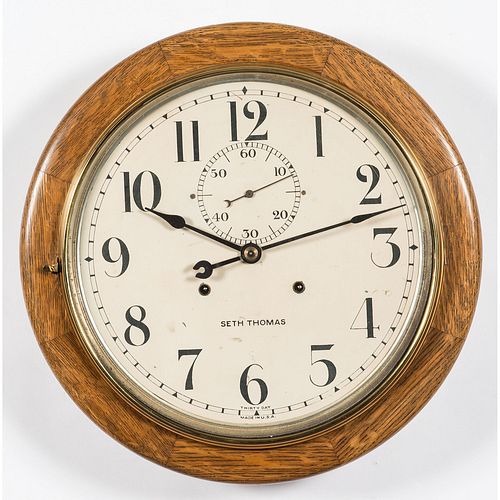 A Seth Thomas Thirty Day Brass and Oak Gallery Clock