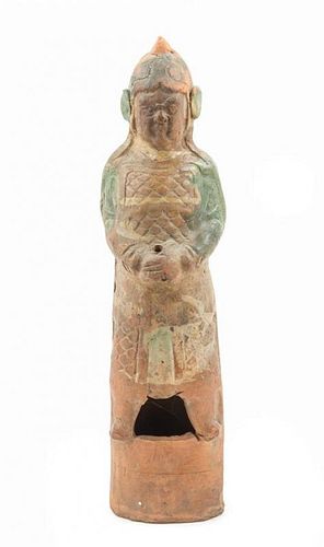 * A Sancai Glazed Pottery Figure of an Attendant Height 21 x width 5 1/2 inches.
