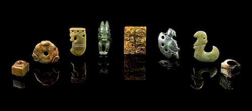 * A Group of Eight Jade Carvings Length of longest 2 3/4 inches.