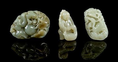 A Group of Three Celadon Jade Toggles Length of longest 3 inches.