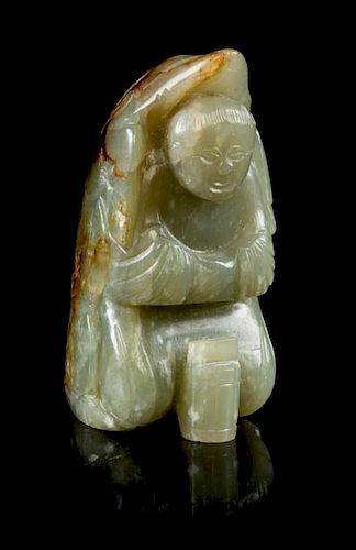 * A Carved Jade Figural Toggle Height 2 1/8 inches.