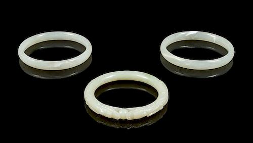 * A Group of Three Plastic Imitating Jade Bangles Diameter of interior of first 2 1/4 inches.