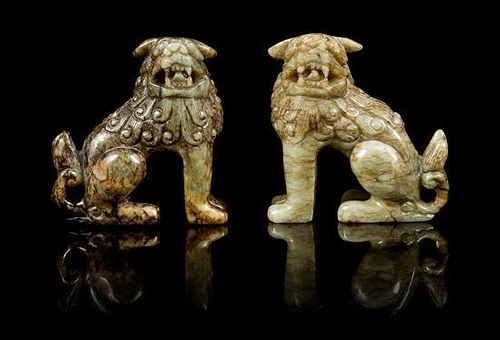 * A Pair of Hardstone Figures of Lions Height of pair 3 1/4 inches.