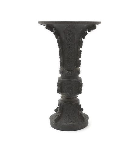 An Archaistic Bronze Gu Vase, Height 8 1/4 inches.