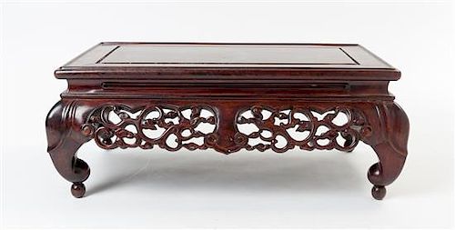 A Carved Rosewood Stand Height 7 1/4 x width 18 x depth 11 inches.