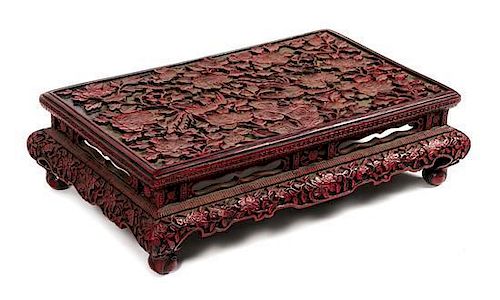 A Cinnabar Lacquer Low Table Height 7 3/4 x width 27 1/2 x depth 17 1/2 inches.