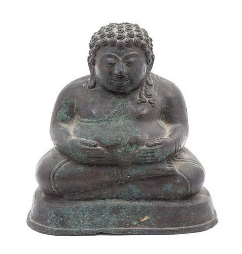 * A Bronze Figure of a Seated Buddha Height 6 1/2 x width 6 inches.