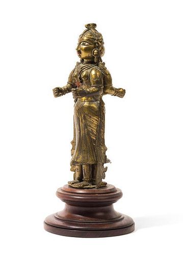 An Indian Figure of a Double-Face Deity Height 8 1/2 inches.