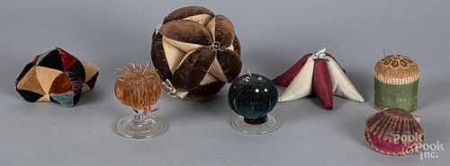 Seven sewing pincushions, ca. 1900