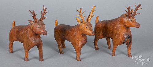 Three carved deer, early 20th c.