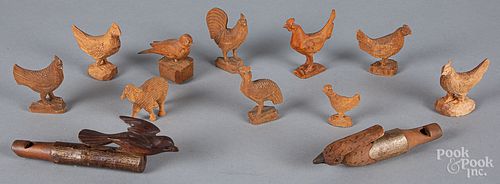 Group of carved animals, bird whistles, etc.
