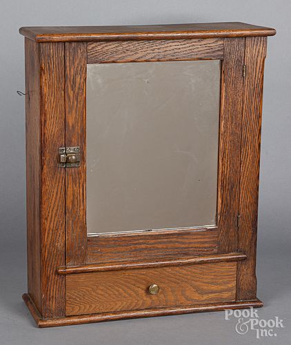 Mirrored oak hanging cabinet, ca. 1900