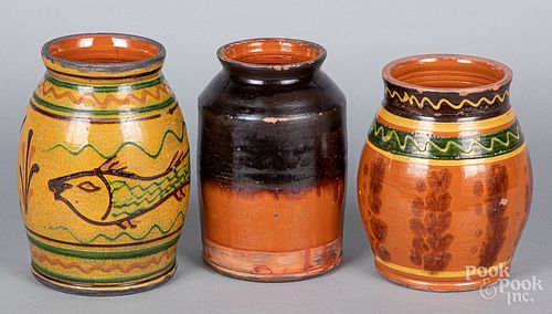 Three Shooner redware jars
