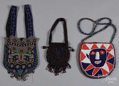 Two beaded purses, together with a dress medallio