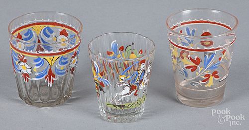 Three Stiegel type enamel decorated glass tumbler