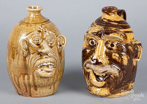 Two southern pottery face jugs