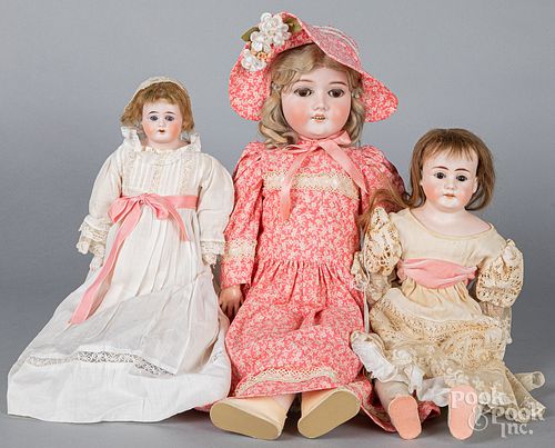 Three bisque dolls