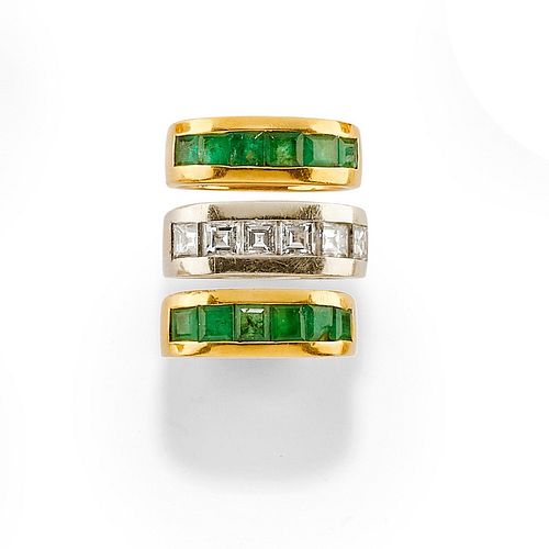 A 18K two-color gold, emerald and diamond rings