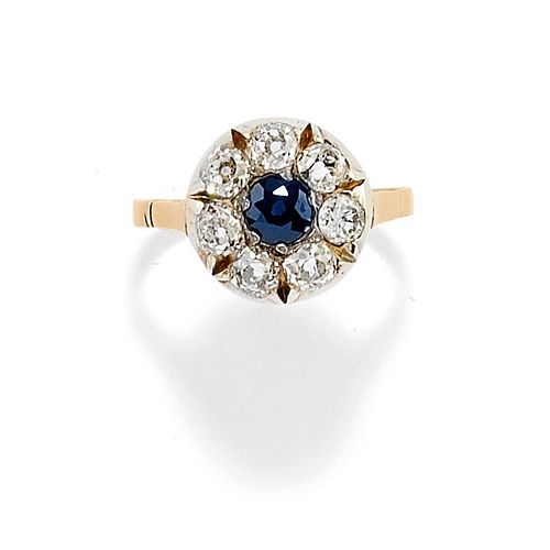 A 18K two-color gold, sapphire and diamond ring