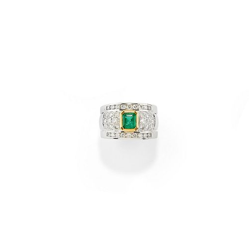 A 18K two-color gold, emerald and diamond ring