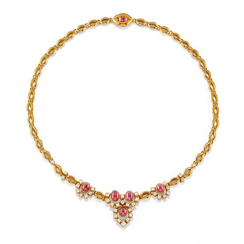 A 18K yellow gold, ruby and diamond demi parure