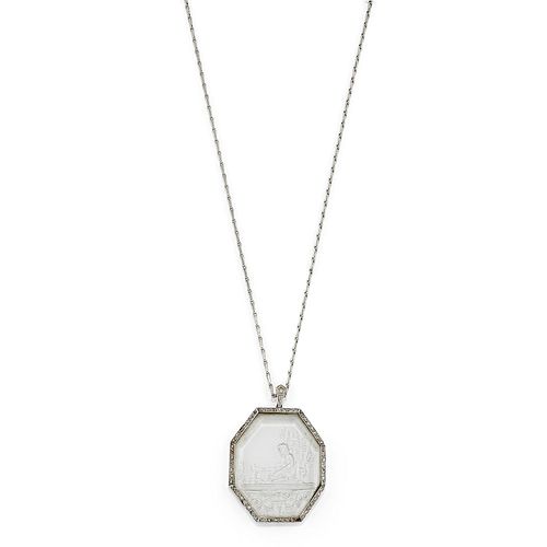 A 18K white gold, crystal rock and diamond pendant
