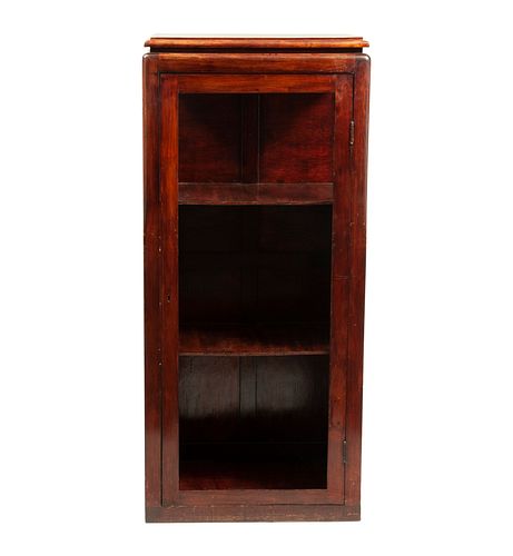 Cabinet. 20th century. Carved in wood. With internal shelves, hinged glass door and plinth-type support. 52.3 x 23.6 x 15.7" (133 x 60 x 40 cm)