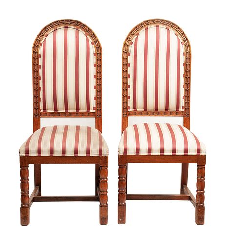 Pair of chairs. 20th century. Carved in wood. With closed backrests and padded seats in beige and red striped upholstery.