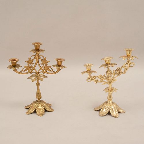 Lot of 2 candelabra. Twentieth century. Made in brass. With floral washers, compound shafts and base.