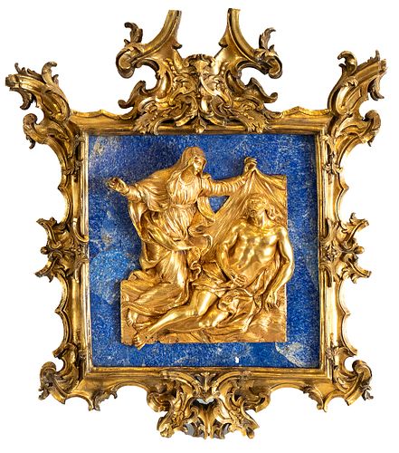 ROMAN MANIFACTURING AND ROMAN SCULPTOR, FIRST DECADES OF THE 18th CENTURY  - Chiseled and gilded bronze frame, jagged edge with rich ornate scrolls an