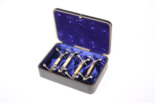 A SET OF FOUR 19TH CENTURY IVORY-MOUNTED SILVER-P