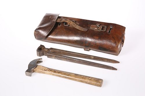 A LEATHER-CASED SET OF FARRIER'S TOOLS FOR SADDLE